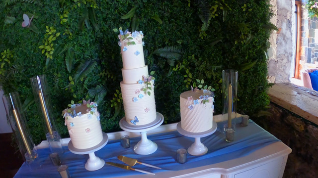 Three wedding cakes on a table